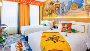 A hotel room with two beds, a mural, and a colorful floor design. - Toy Story Hotel (Shanghai)