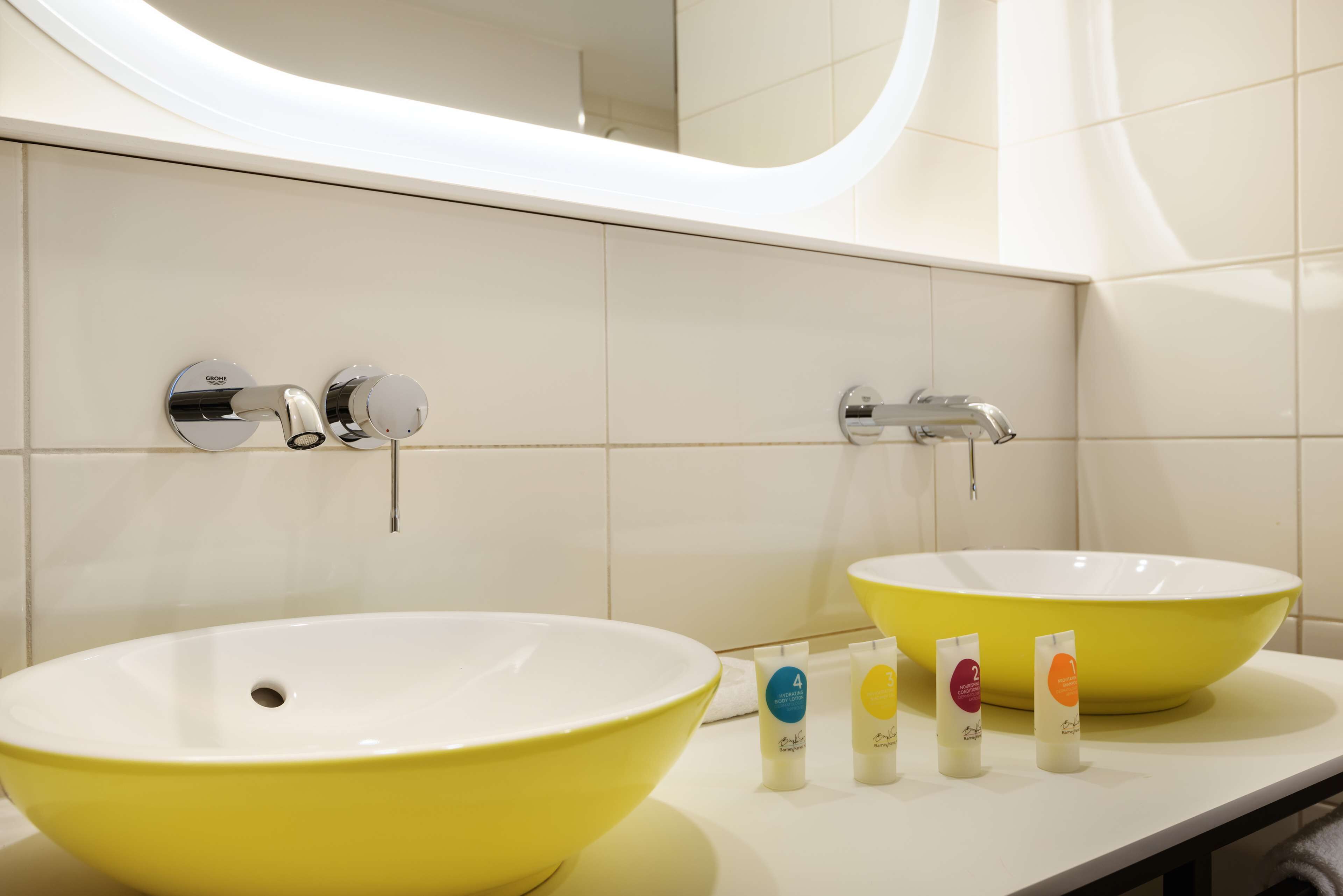 suite, 1 king bed | bathroom | rainfall showerhead, free toiletries, hair dryer, towels