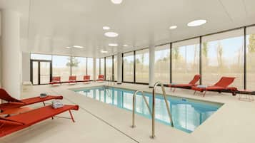 Indoor pool, open 6:00 AM to 10:00 PM, pool loungers