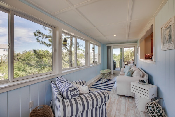 Sunroom overlooking the sea foliage/river/marsh