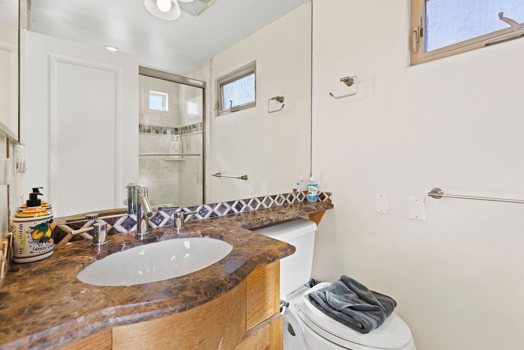 2nd full bathroom with tub and shower, across from 2nd bedroom