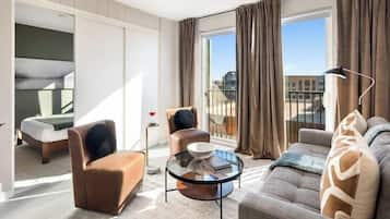 Executive Apartment, 2 Bedrooms, Kitchen | Living area | 58-inch Smart TV with cable channels, TV, Netflix