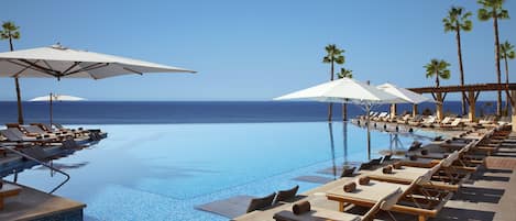 4 outdoor pools, pool umbrellas, pool loungers