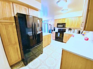 Fridge, microwave, oven, stovetop - Mid-Century Modern Boise Bench Home Near Airport and Downtown with Theater Room (Boise)