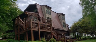 Awesome Lake House with Natural Beach, Huge Dock, and Sunset Views. Sleeps 9