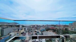 A cityscape view from a high-rise building with a clear sky.