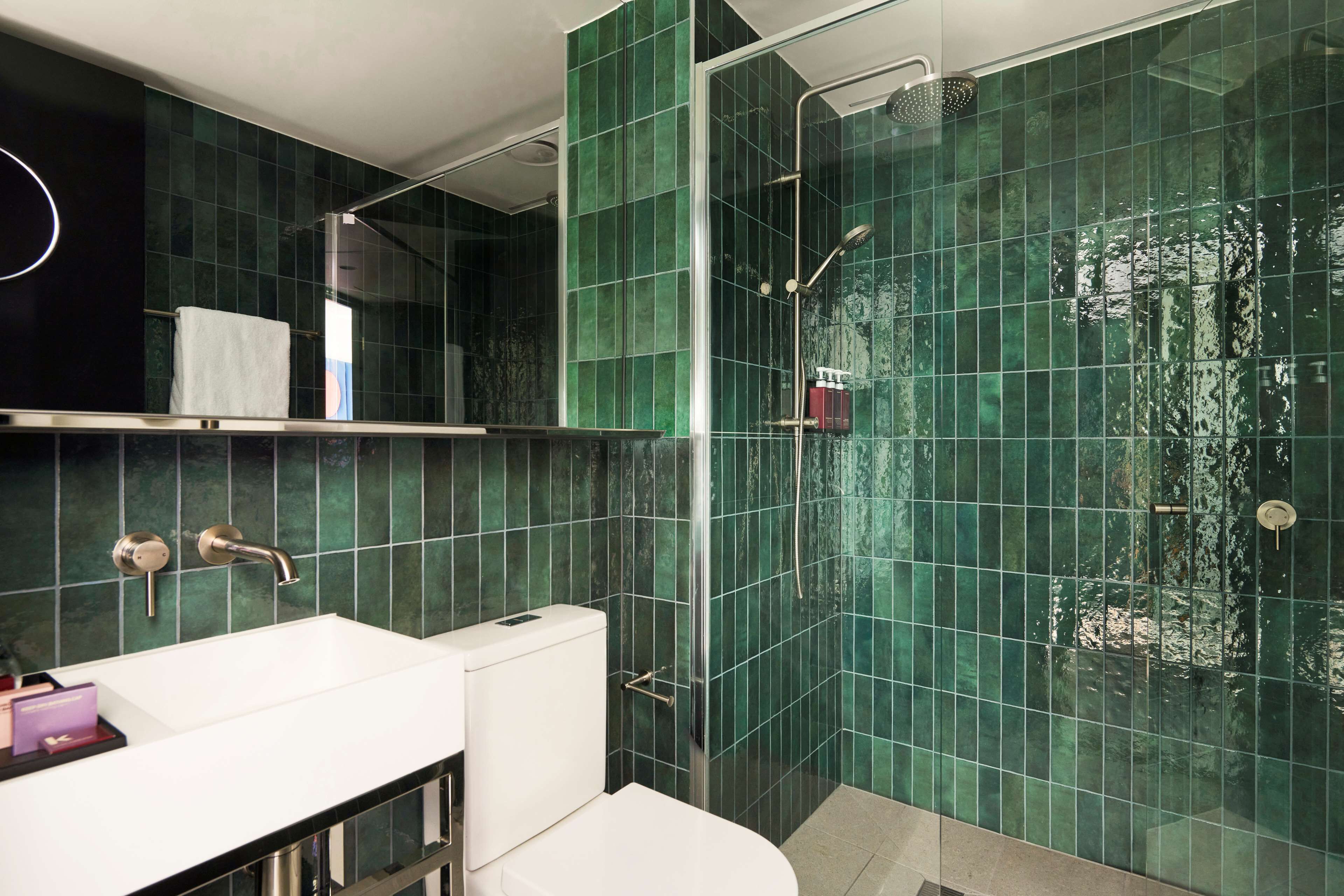 designer toiletries, hair dryer, towels, soap