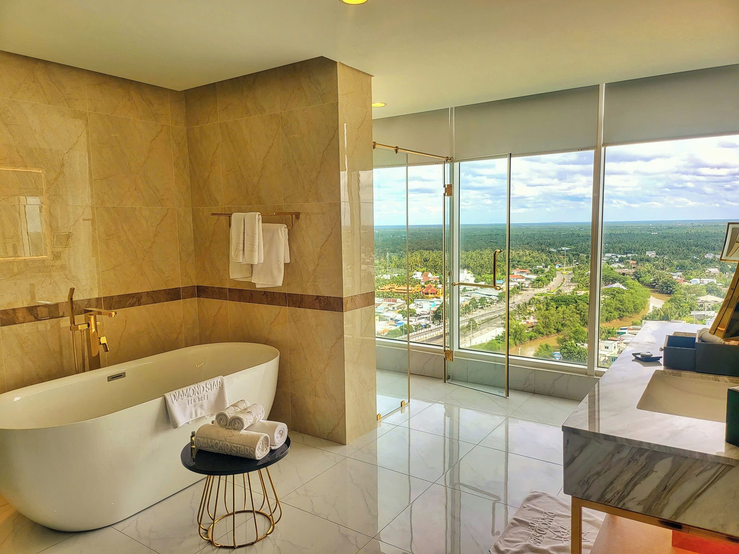 elite suite room | bathroom | separate bathtub and shower, free toiletries, hair dryer, bathrobes