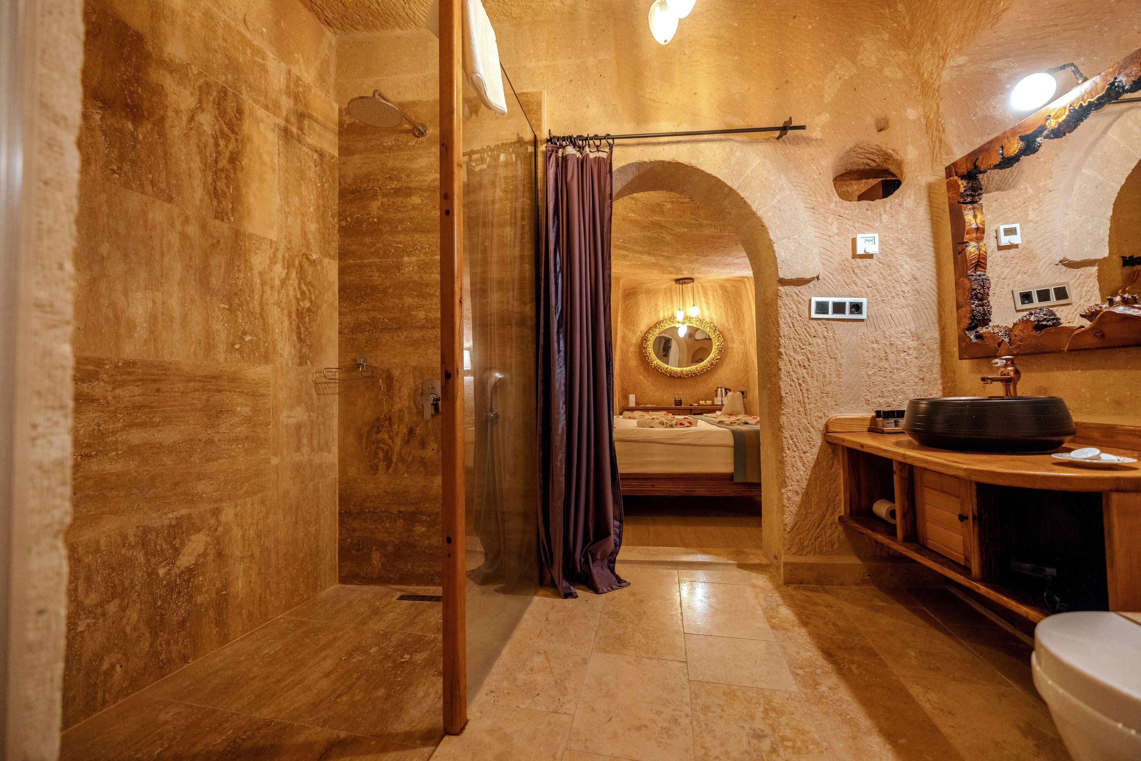 king suite | bathroom | designer toiletries, hair dryer, bathrobes, slippers
