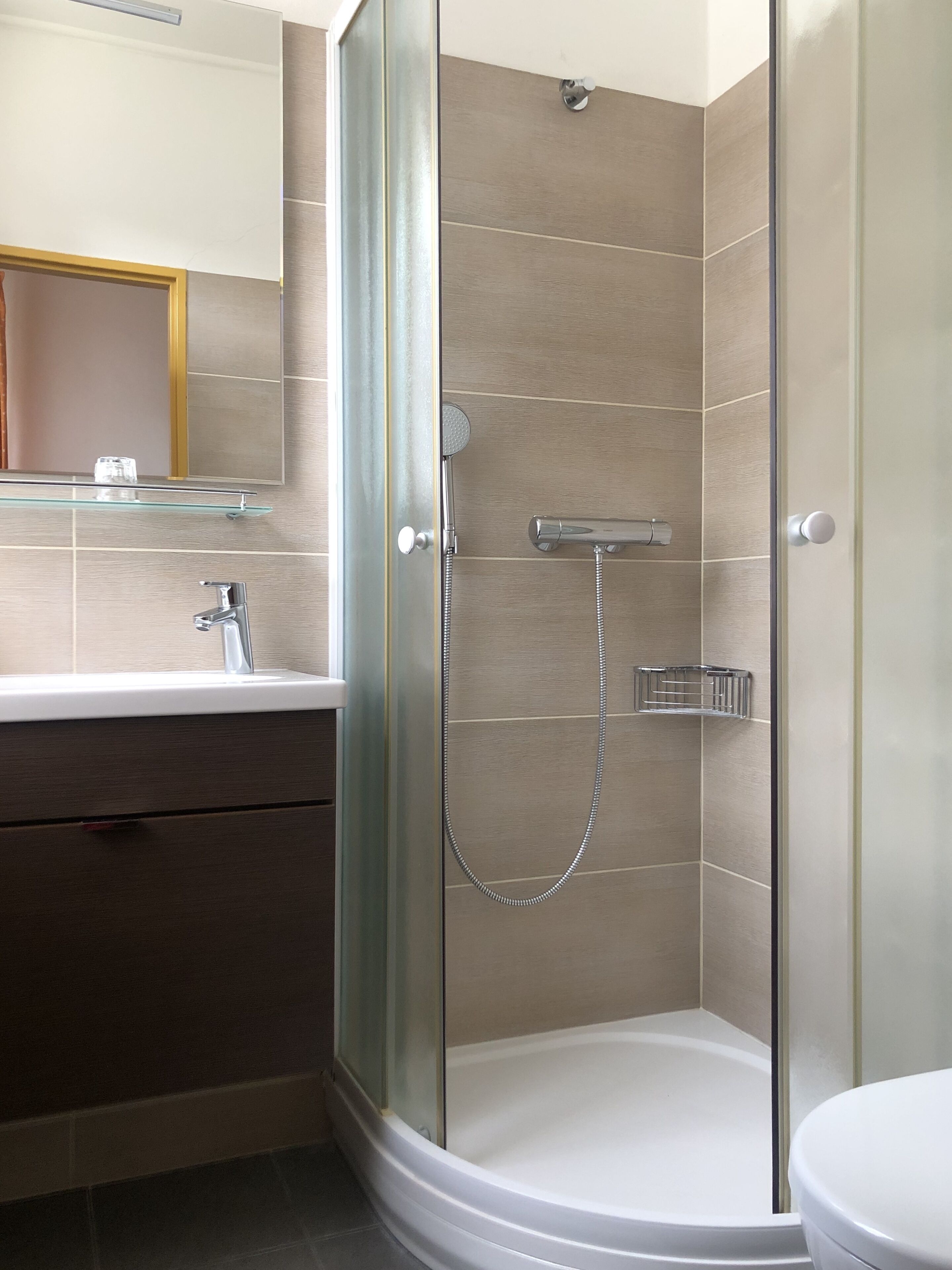 Shower, towels, soap, toilet paper