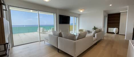 Presidential Penthouse | Living area | 55-inch LED TV with satellite channels, TV