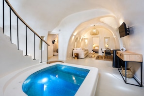 Royal Suite Indoor Hot Tub | Living area | Flat-screen TV - Hill Suites (Santorini)