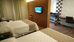 Deluxe Room | Minibar, desk, laptop workspace, blackout curtains