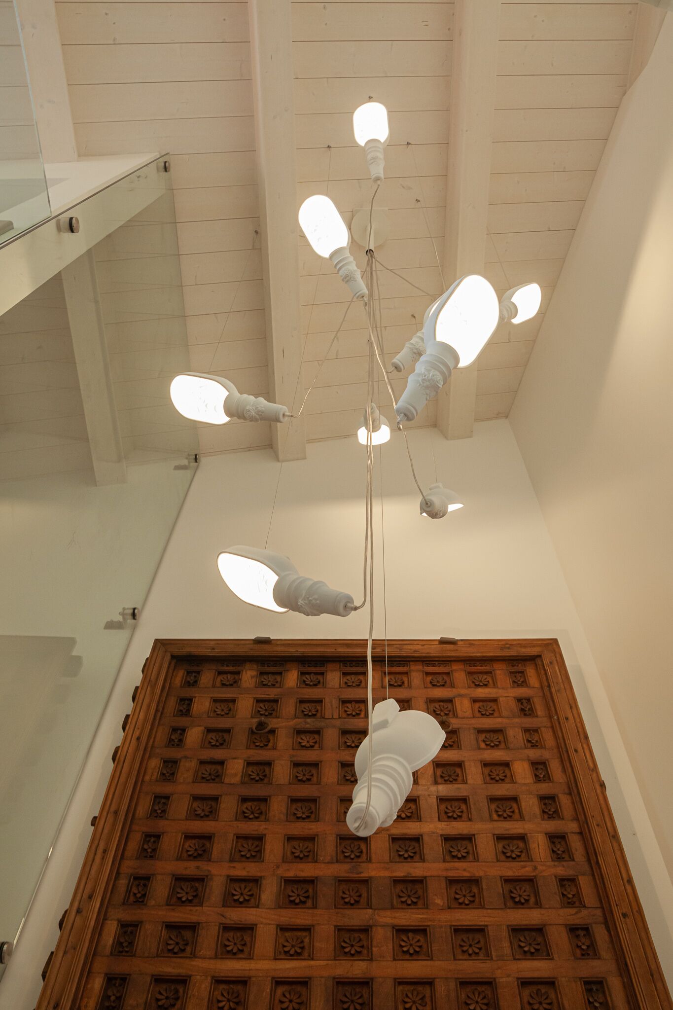 A ceiling with a unique light fixture design.