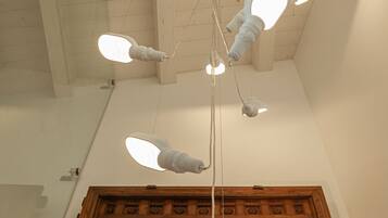 A ceiling with a unique light fixture design.