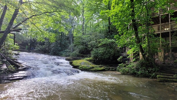 A multi-level wooden structure with a river flowing through a forested area. - Bear Gone Fishing- Cool Down in the Creek!!! Mins to Highlands (Scaly Mountain)