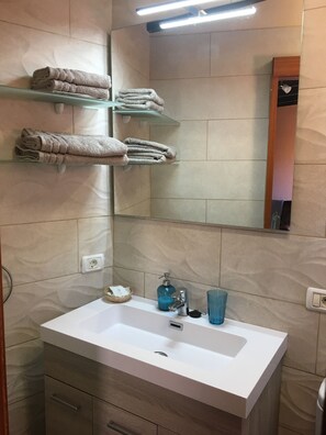 Shower, hair dryer, towels, soap