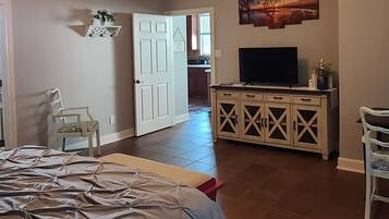 1 bedroom, desk, iron/ironing board, travel crib