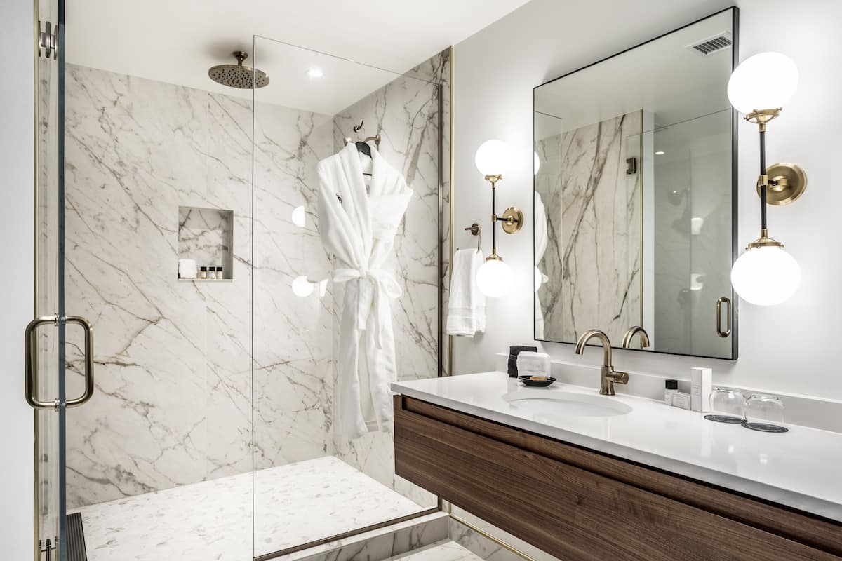 designer toiletries, hair dryer, bathrobes, slippers