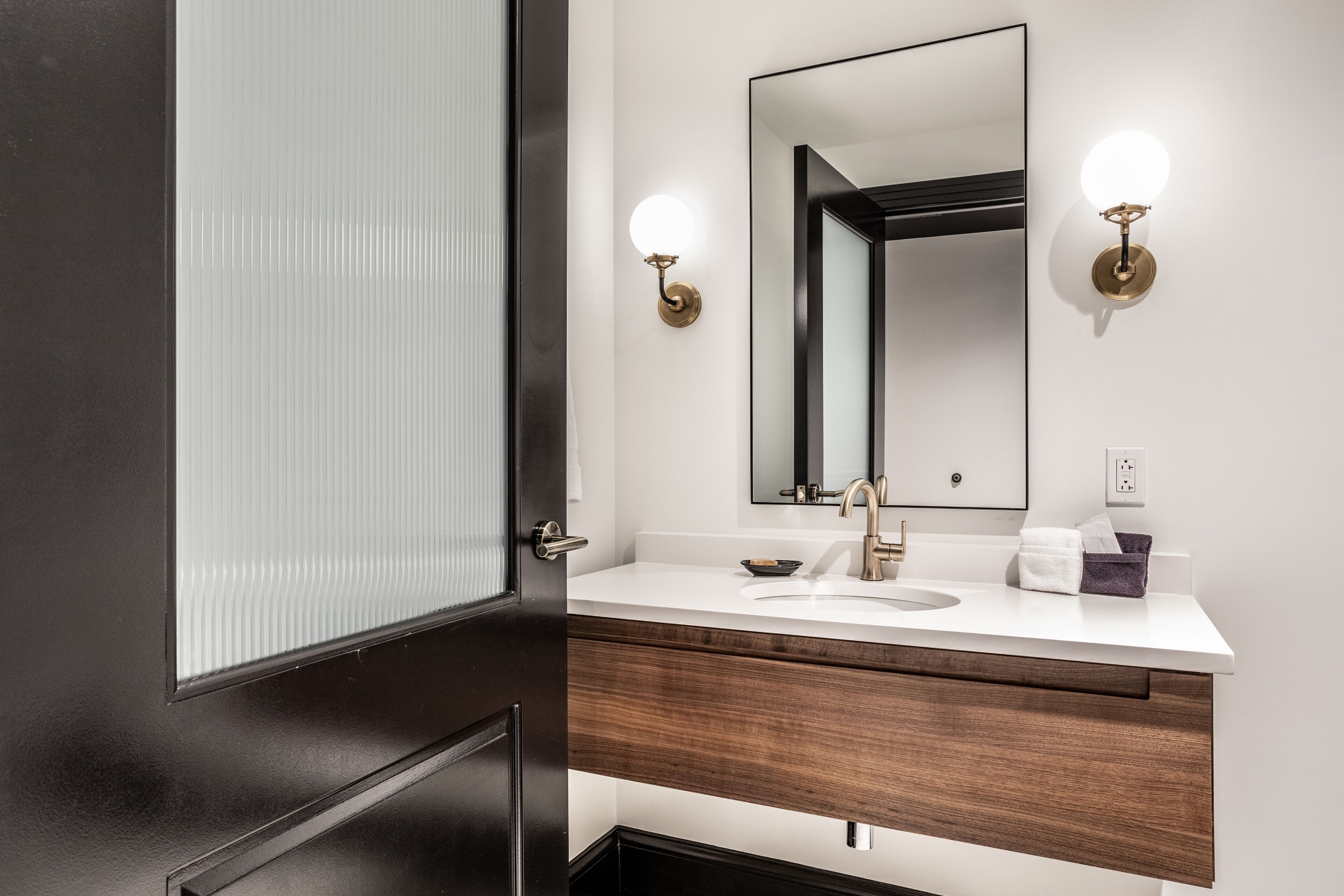 designer toiletries, hair dryer, bathrobes, slippers