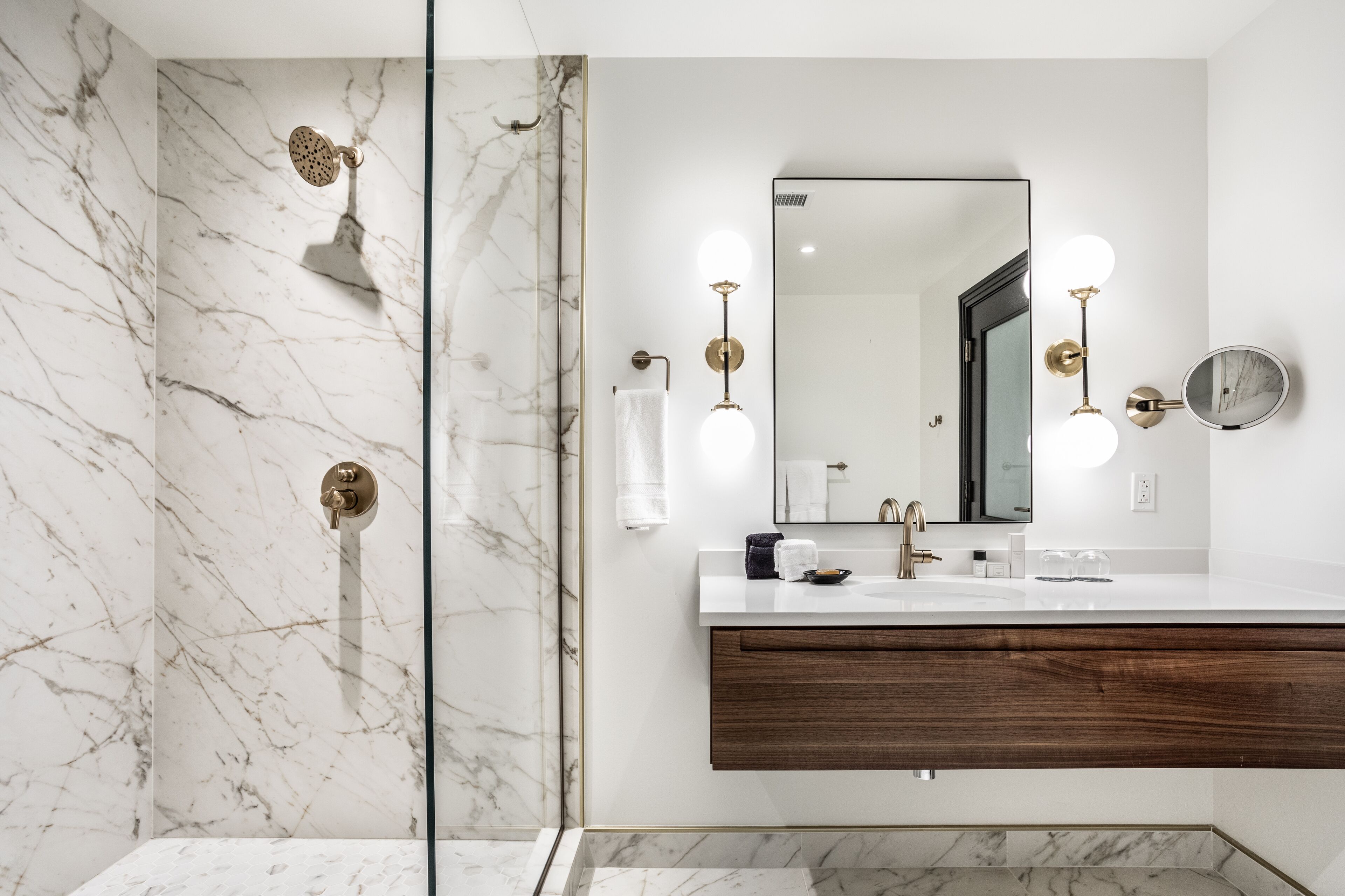 designer toiletries, hair dryer, bathrobes, slippers