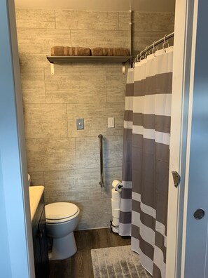 Combined shower/bathtub, hair dryer, towels, soap