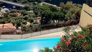 A pool with a view of a cityscape and greenery. - GuestHost - Nice 30sqm studio apartment with breathtaking panoramic sea view, located on the 2nd floor of a building with lift. 10sqm balcony equipped with table, chairs and outdoor furniture to have lunch or enjoy an aperitif while admiring the blue of  (Taormina)