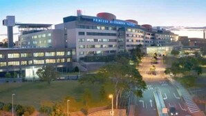 A multi-story hotel with a modern architectural design, featuring a prominent signage for 'Princess Alexandra Court.' - Modern Twist + Old World Charm ~ 3Bed/2Bath/2Car (Kedron)