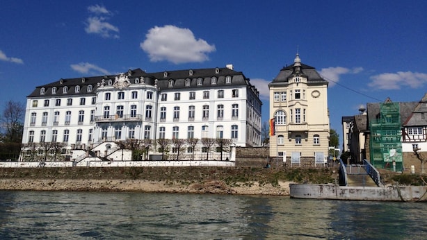 A large, historic building with multiple stories and a prominent clock tower. - Hotel zur Schloß-Schenke (Neuwied)
