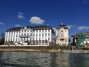A large, historic building with multiple stories and a prominent clock tower. - Hotel zur Schloß-Schenke (Neuwied)