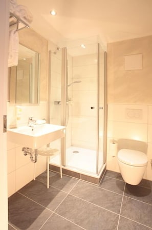 Shower, rainfall showerhead, hair dryer, towels