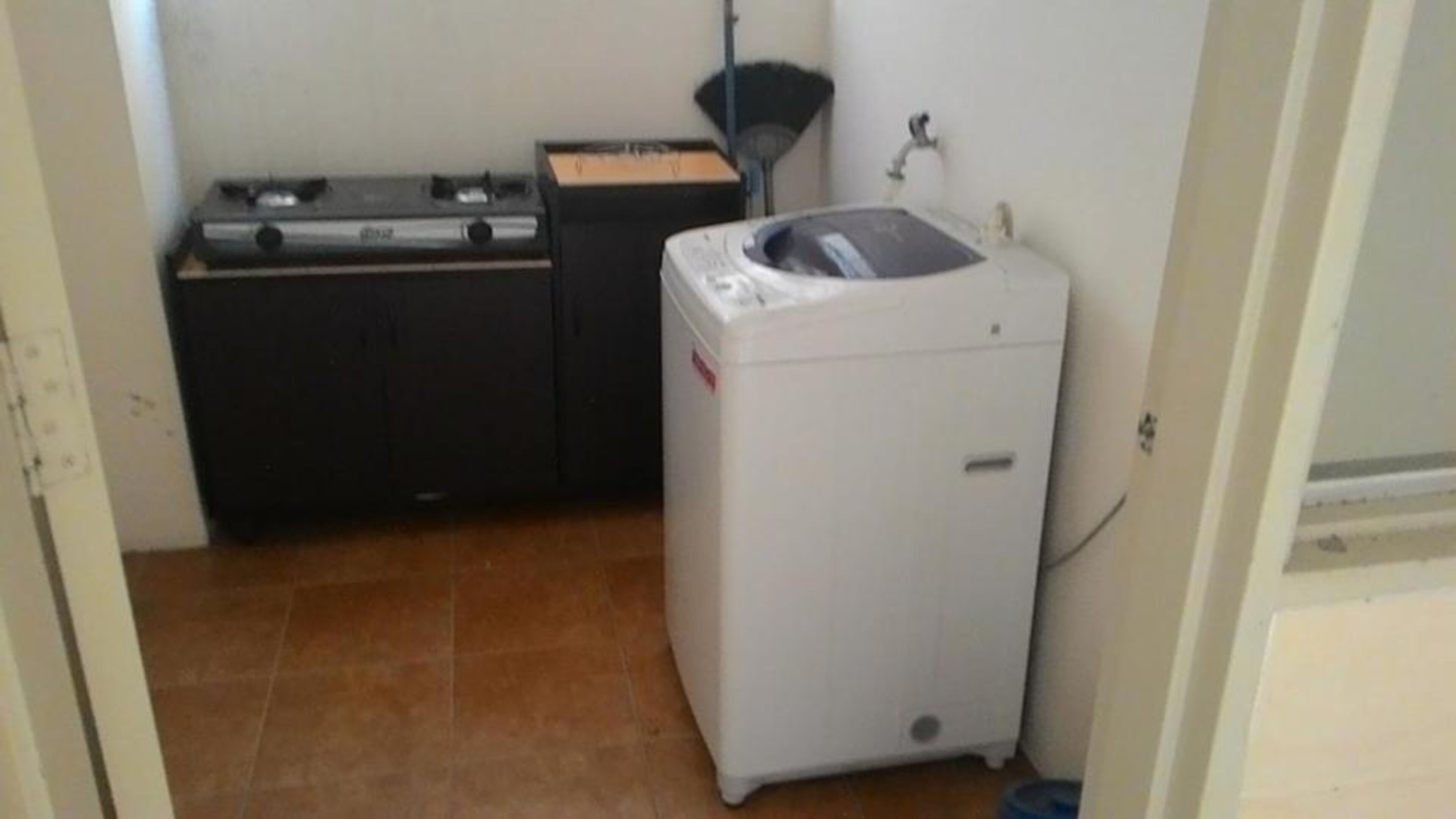 A compact laundry room with a washing machine and a dryer.