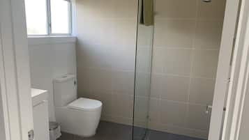 Shower, towels, soap, toilet paper