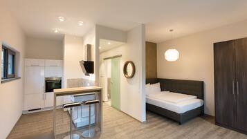 Basic Studio | Living area | Flat-screen TV, heated floors