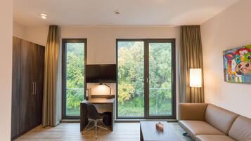 Basic Studio | Living area | Flat-screen TV, heated floors