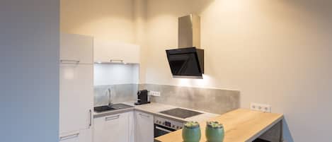 Apartamento superior | Cozinha privada | Fogão, cooktop, lava-louças, chaleira elétrica