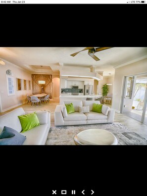 Enjoy a spacious living area with a dining table, kitchen, and cozy seating area.