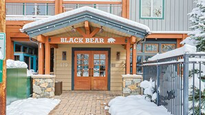 A building with a sign reading "BLACK BEAR" and a stone facade. - River Run Village Walk To Gondola Pool Hot Tubs Restaurants and Shops DELUXE (Keystone)