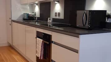 Apartment | Private kitchen | Full-sized fridge, microwave, oven, stovetop