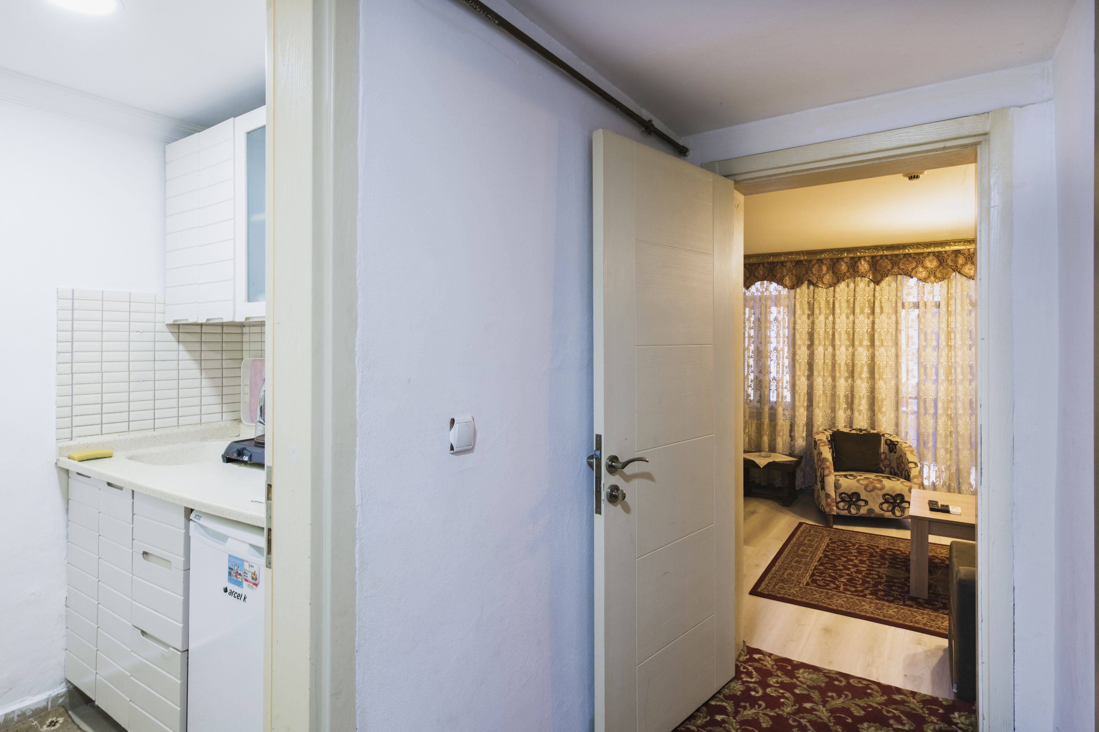 family room | private kitchen | mini-fridge, electric kettle, cleaning supplies, paper towels