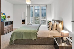 1 bedroom, desk, iron/ironing board, travel crib