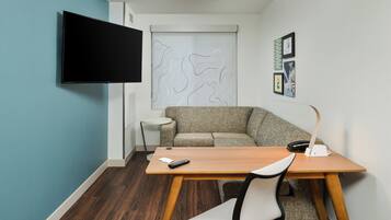 55-inch flat-screen TV with cable channels, TV