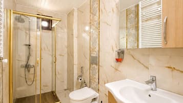 Apartment, 2 Bedrooms | Bathroom | Rainfall showerhead, free toiletries, hair dryer, slippers