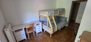 A room with a bunk bed, a desk, and a chair. - Iglica Apartments - First Floor, Lakes Bled and Bohinj (Bohinjska Bela)
