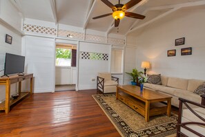 Deluxe Suite, 2 Bedrooms, Kitchen, Ocean View | Living room | 50-inch Smart TV with digital channels, TV - Victoria House (Frederiksted)