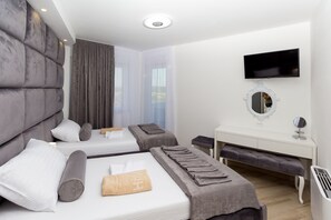 6 chambres, coffres-forts dans les chambres, fer et planche à repasser