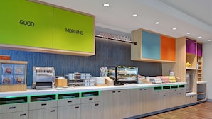A breakfast bar with a 'GOOD MORNING' sign, a 'PAINTY' section, and a 'Inspired Table' sign. - Home2 Suites by Hilton Largo (Largo)