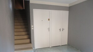 A hallway with a staircase, a double door, and a tiled floor. - 4 to 6 berth accommodation 10 mi walk from the lake (Clairvaux-les-Lacs)