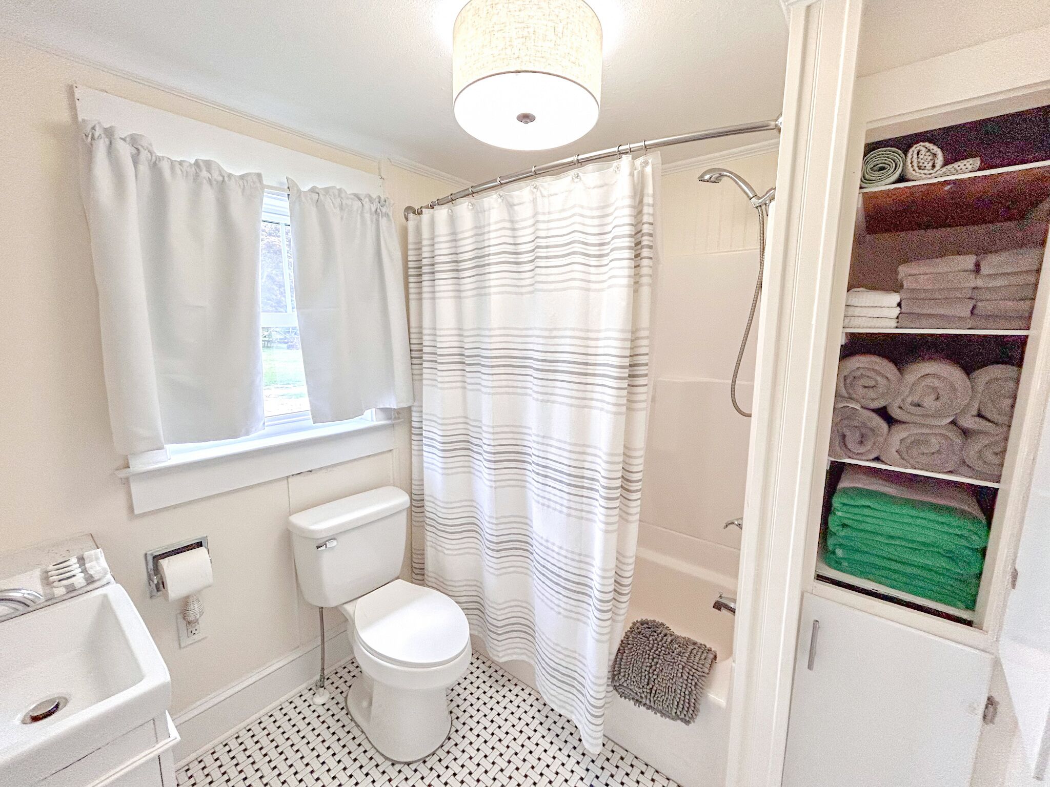 Combined shower/tub, hair dryer, towels, soap