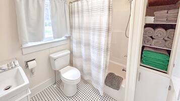 Combined shower/tub, hair dryer, towels, soap